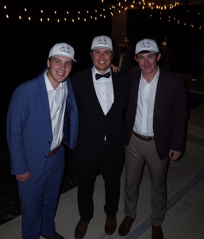 Anthony, Wilson, and Keaton from X Home at a company event
