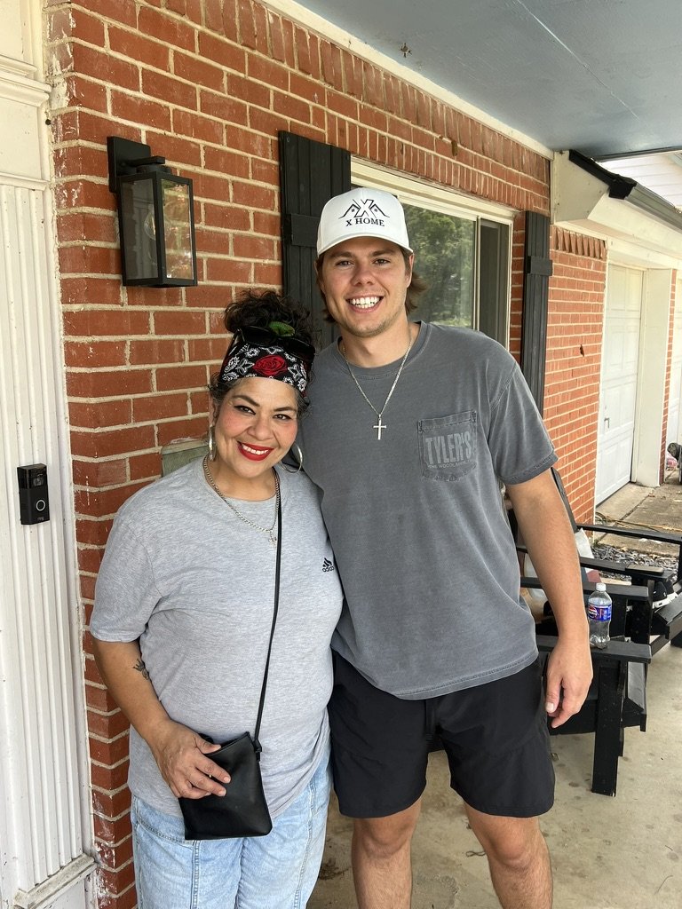 Crystal Lopez standing on her porch with Wilson from X Home after we helped her stop her foreclosure